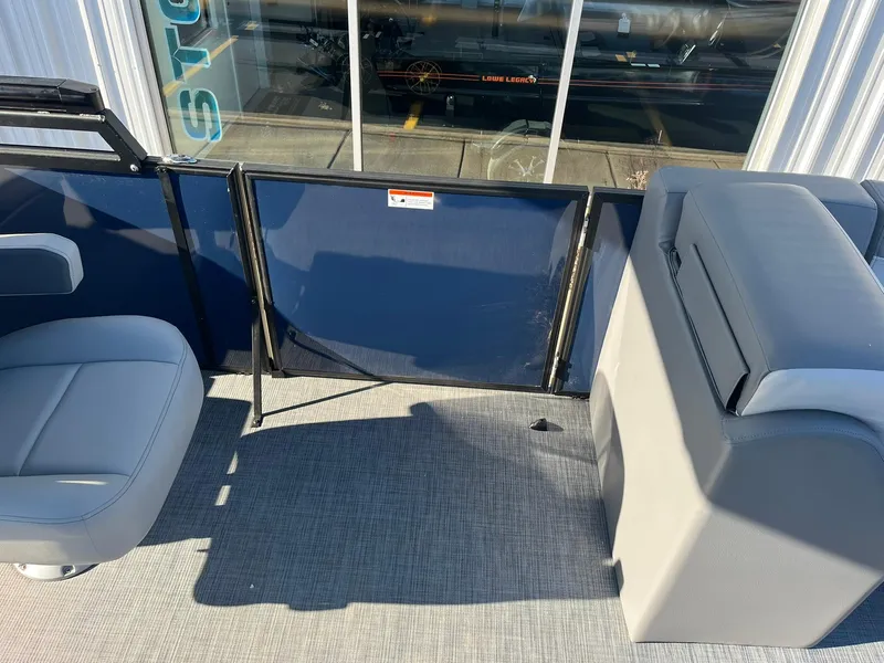 Slide: The Image of Interior of 2025 Lowe LS 230 WT boat with seating and storage. - 17