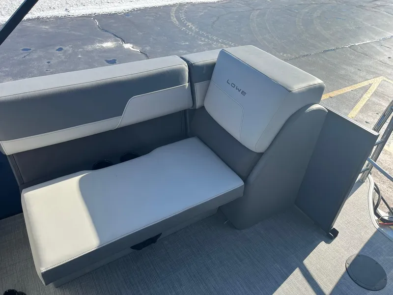Slide: The Image of 2025 Lowe LS 230 WT boat seat with gray upholstery. - 19