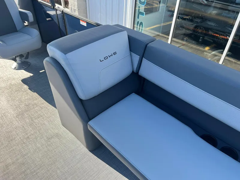 Slide: The Image of 2025 Lowe LS 230 WT boat seating with gray and white upholstery. - 22
