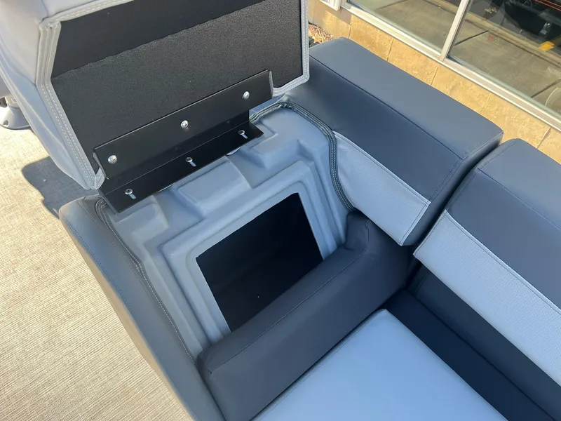Slide: The Image of 2025 Lowe LS 230 WT boat seat with open storage compartment. - 23