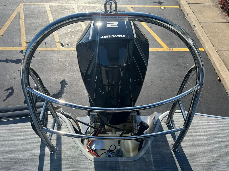 Slide: The Image of 2025 Lowe LS 230 WT boat with Mercury engine, viewed from above in parking lot. - 26