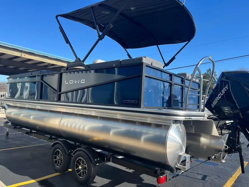 Slide: The Image of 2025 Lowe LS 230 WT pontoon boat with Mercury engine on trailer. - 5