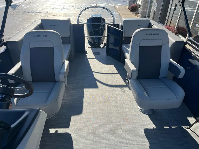 Slide: The Image of 2025 Lowe LS 230 WT boat interior with plush seating and modern design. - 7