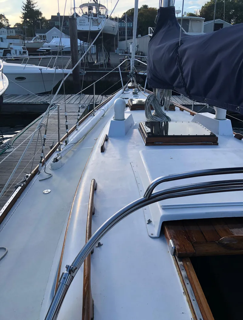 Slide: The Image of 1968 LeComte Northeast 38 sailboat docked, showcasing deck and rigging details. - 15
