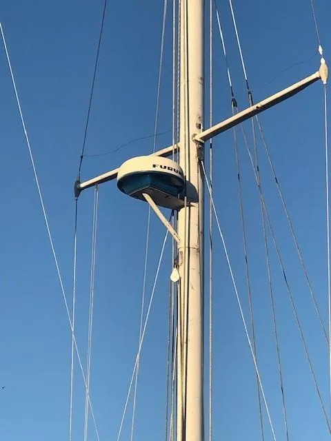Slide: The Image of Mast of 1968 LeComte Northeast 38 sailboat with radar equipment against clear blue sky. - 22