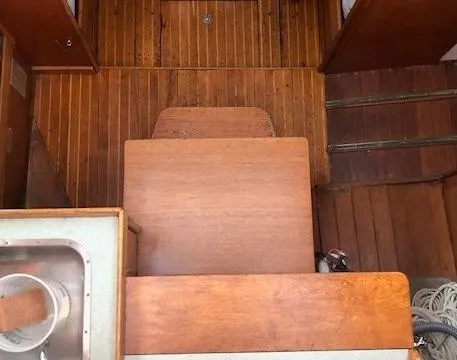 Slide: The Image of Interior of 1968 LeComte Northeast 38 sailboat with wooden flooring and cabinetry. - 25