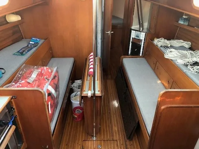 Slide: The Image of Interior of 1968 LeComte Northeast 38 sailboat with wooden furnishings and twin berths. - 27