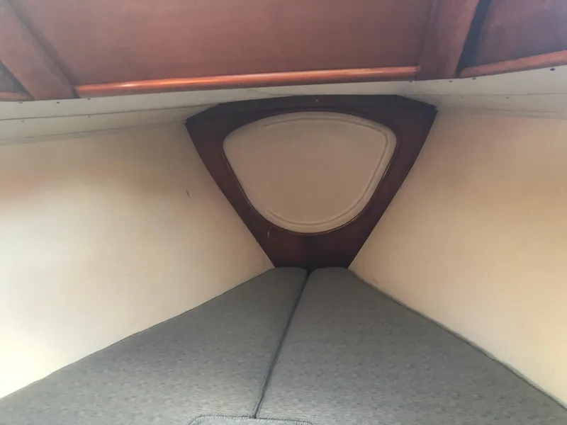 Slide: The Image of Interior cabin of 1968 LeComte Northeast 38 sailboat with wooden trim and cushioned berth. - 31