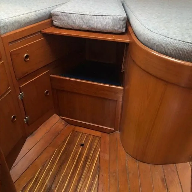 Slide: The Image of Interior of 1968 LeComte Northeast 38 sailboat with wooden cabinetry and cushioned seating. - 32