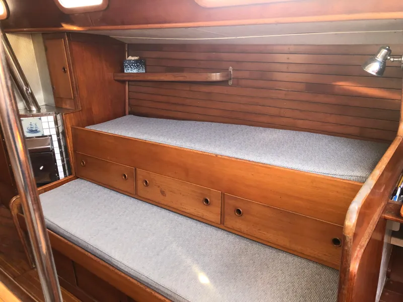 Slide: The Image of Interior of 1968 LeComte Northeast 38 sailboat with wooden bunks and storage drawers. - 46