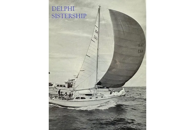 Slide: The Image of 1968 LeComte Northeast 38 sailboat, "Delphi Sistership," sailing with full sails on open water. - 74