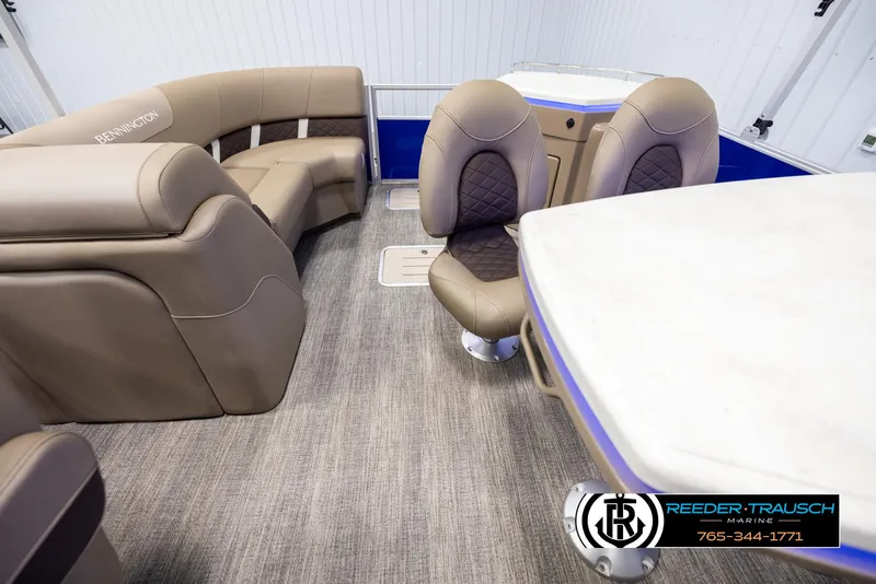 Slide: The Image of Interior of 2025 Bennington 23 SXPDSE pontoon boat with luxurious seating and table. - 15