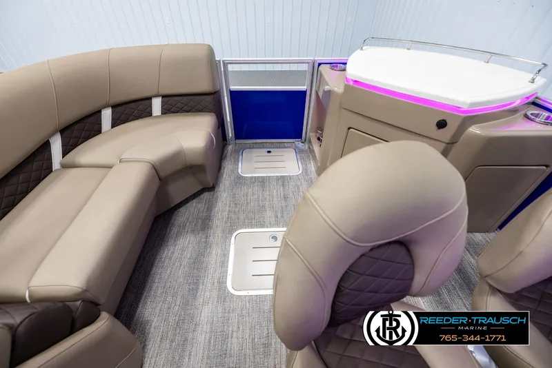Slide: The Image of Interior of 2025 Bennington 23 SXPDSE pontoon boat with luxurious seating and modern design. - 16