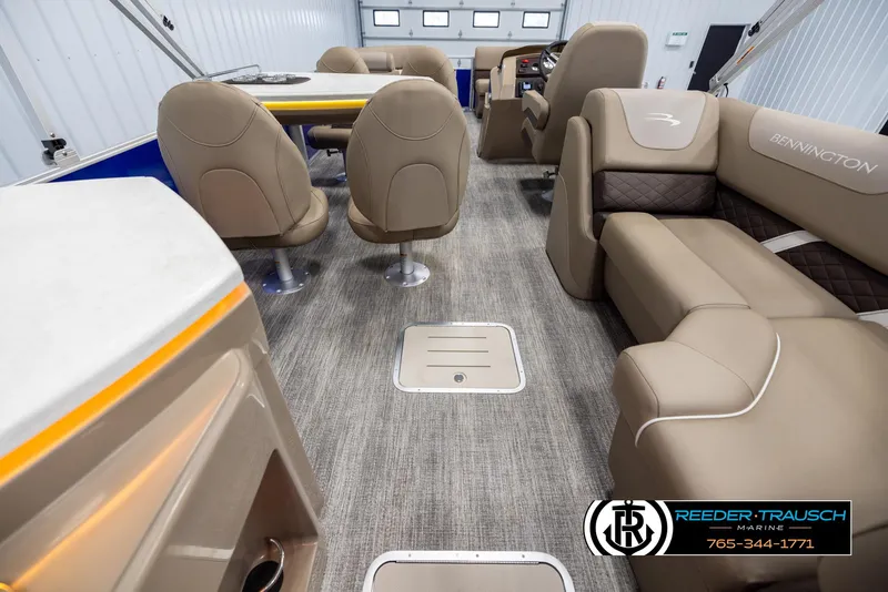 Slide: The Image of 2025 Bennington 23 SXPDSE boat interior with beige seating and modern design. - 17