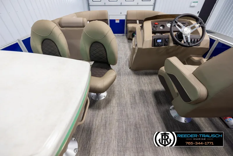 Slide: The Image of Interior of 2025 Bennington 23 SXPDSE pontoon boat with luxurious seating and modern dashboard. - 18