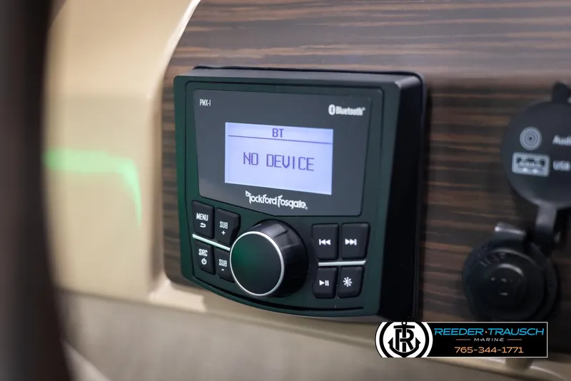 Slide: The Image of Rockford Fosgate Bluetooth stereo on 2025 Bennington 23 SXPDSE boat dashboard. - 28