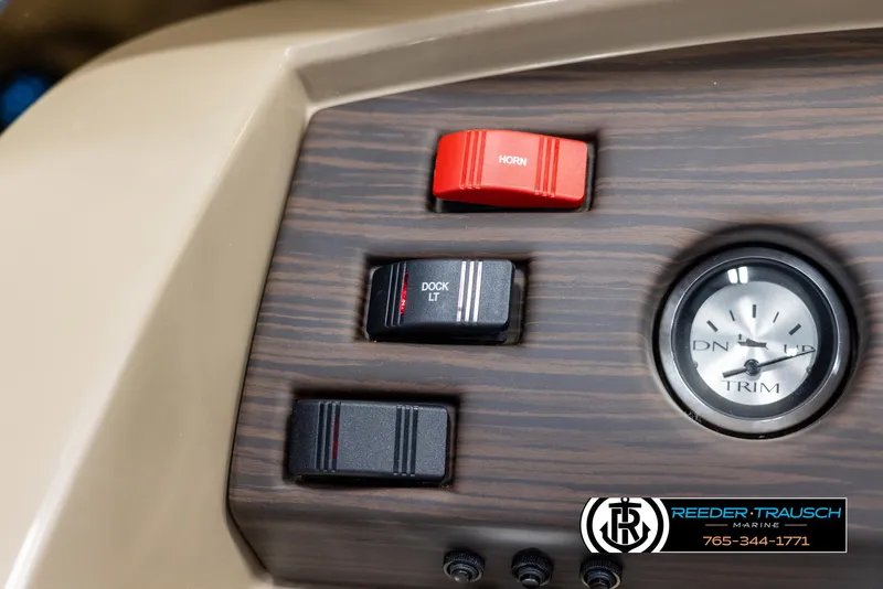 Slide: The Image of Dashboard controls of 2025 Bennington 23 SXPDSE boat with trim gauge and switches. - 29