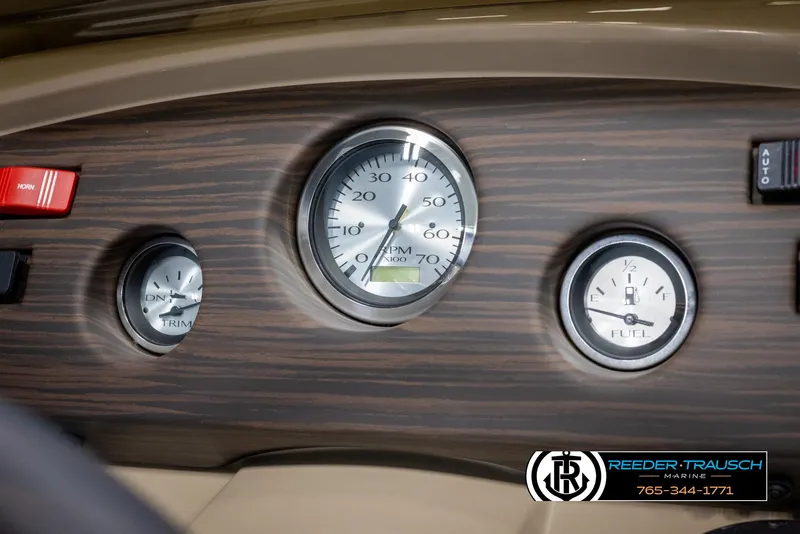 Slide: The Image of Dashboard of 2025 Bennington 23 SXPDSE with gauges and controls. - 30