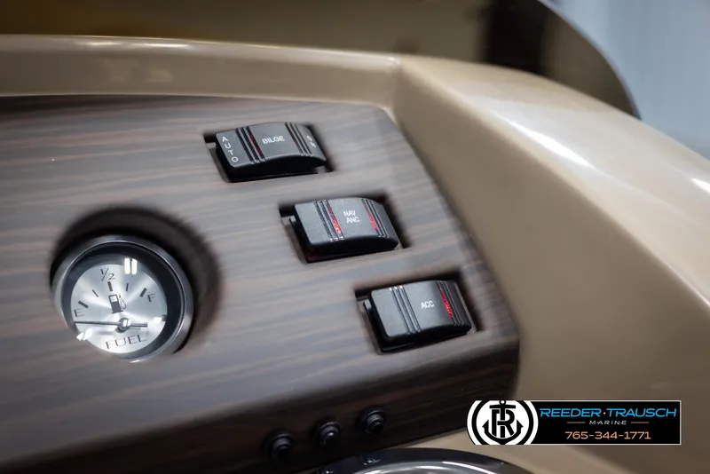 Slide: The Image of Dashboard controls of 2025 Bennington 23 SXPDSE boat with fuel gauge and switches. - 31