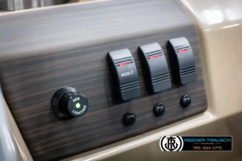 Slide: The Image of Control panel of 2025 Bennington 23 SXPDSE boat with RGB lighting and switches. - 32