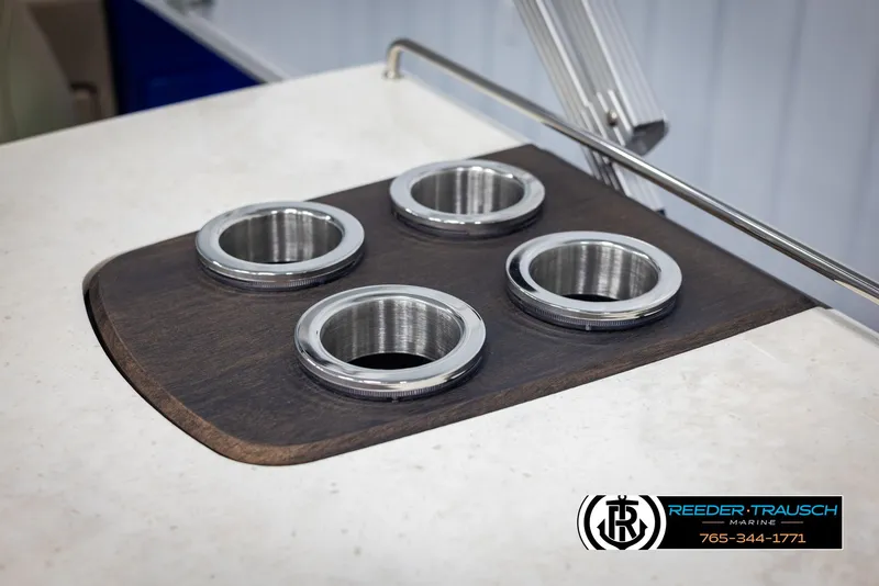 Slide: The Image of Cup holders on a 2025 Bennington 23 SXPDSE boat, featuring sleek stainless steel design. - 41