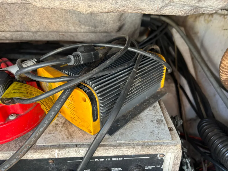 Slide: The Image of Battery charger and cables inside a 2001 Donzi 26 ZF boat. - 13