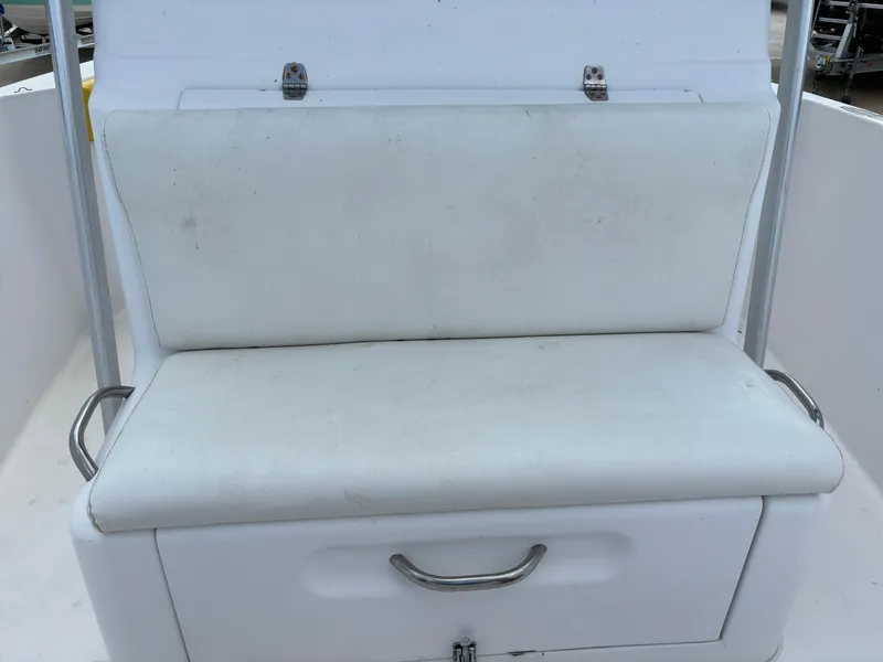 Slide: The Image of White cushioned seat on 2001 Donzi 26 ZF boat, featuring storage compartment. - 16