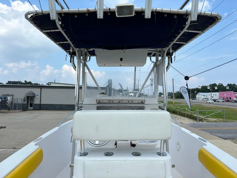 Slide: The Image of 2001 Donzi 26 ZF boat interior with T-top and seating, docked at marina. - 4