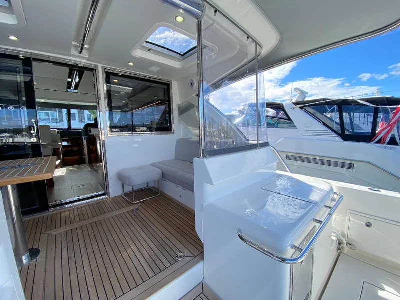Slide: The Image of Luxurious 2025 Riviera 465 SUV yacht interior with sleek design and spacious deck. - 10