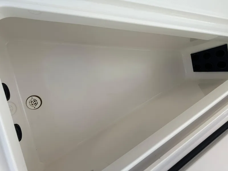 Slide: The Image of 2019 Regulator 23 FS boat storage compartment, clean and spacious interior. - 23