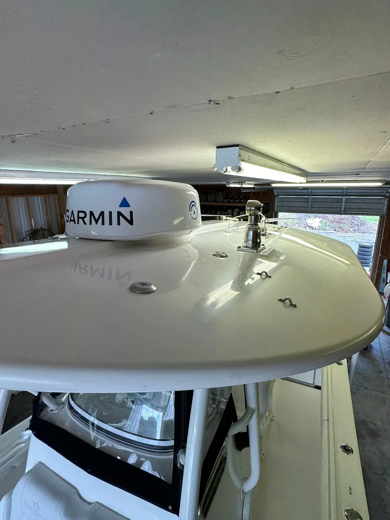 Slide: The Image of 2019 Regulator 23 FS boat with Garmin radar in a garage. - 24