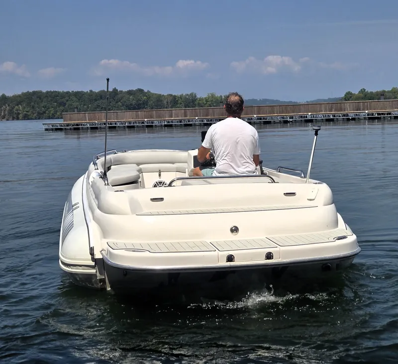 Slide: The Image of 2007 Novurania 6.0 Custom boat on a calm lake, rear view. - 5