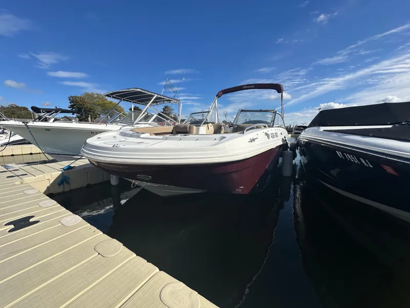 Slide: The Image of 2019 Hurricane SD191 boat docked under clear blue sky. - 2