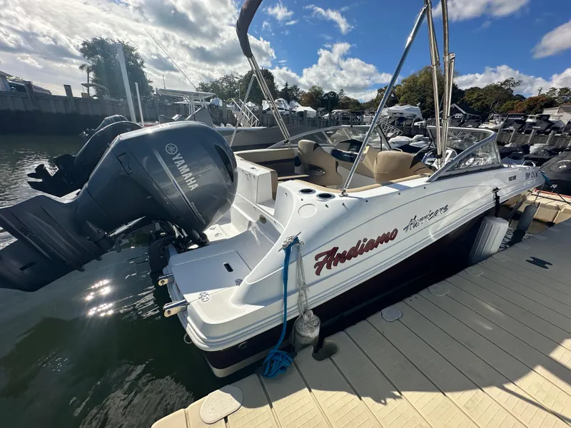 Slide: The Image of 2019 Hurricane SD191 boat docked with Yamaha outboard motor, under a sunny sky. - 3