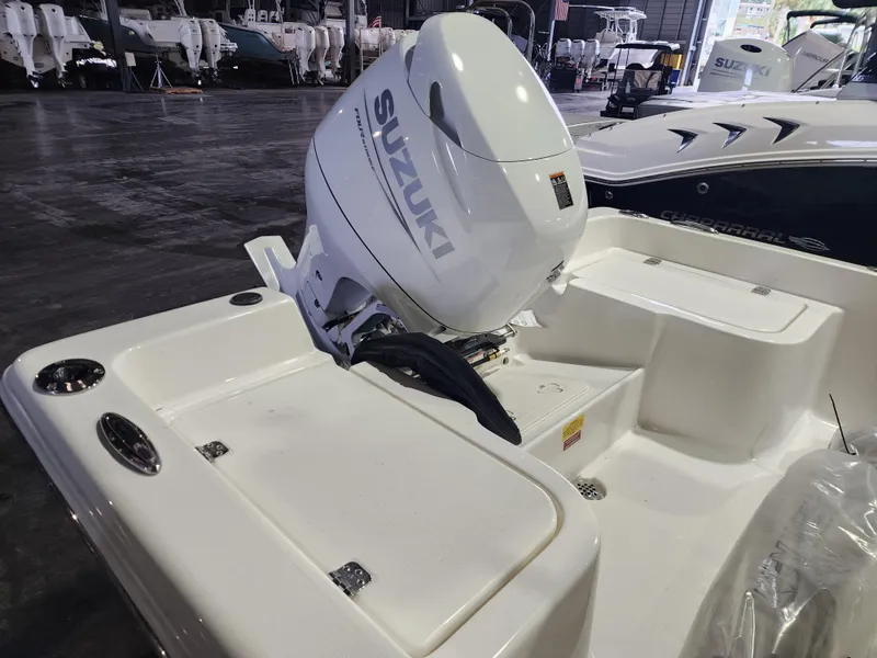 Slide: The Image of 2025 Key West 1720 Center Console boat with Suzuki outboard motor in a showroom. - 6