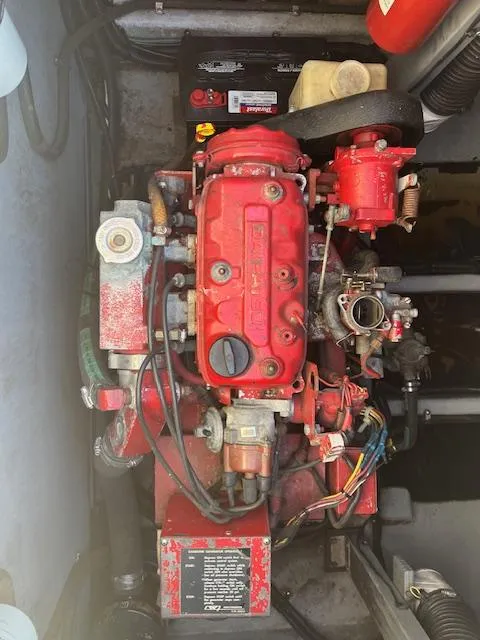 Slide: The Image of Engine of 1996 Sea Ray 380 Sun Sport, featuring red components and wiring. - 16