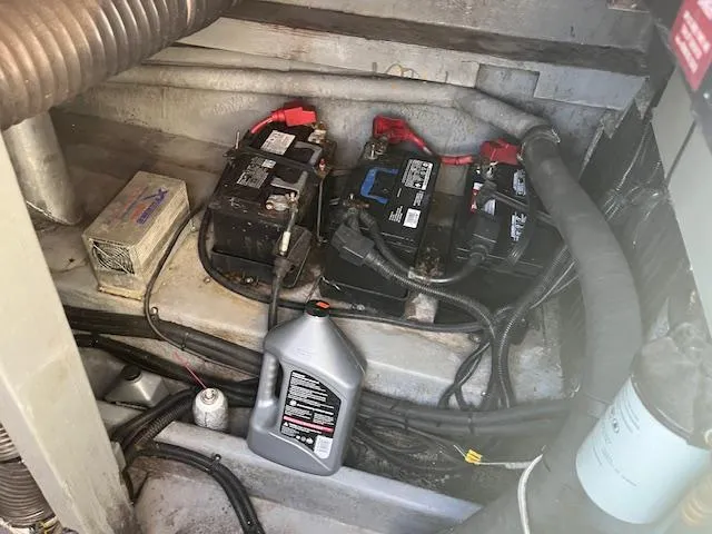 Slide: The Image of Engine compartment of 1996 Sea Ray 380 Sun Sport with batteries and cables. - 19