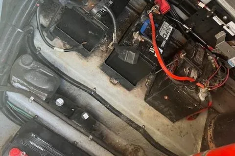 Slide: The Image of Engine compartment of a 1996 Sea Ray 380 Sun Sport with visible batteries and wiring. - 20