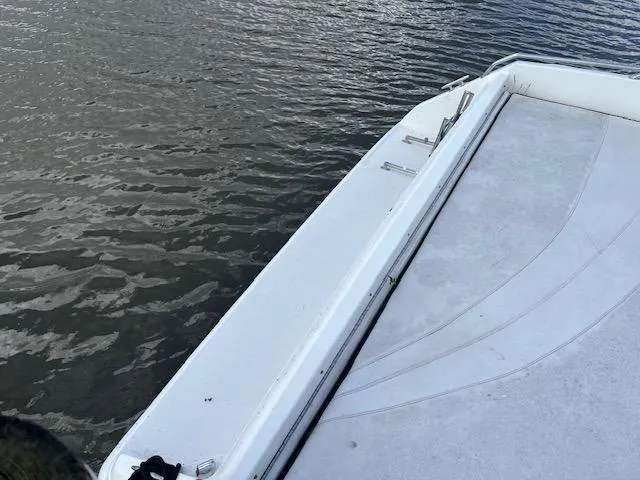 Slide: The Image of Sea Ray 380 Sun Sport 1996 boat deck by the water. - 4