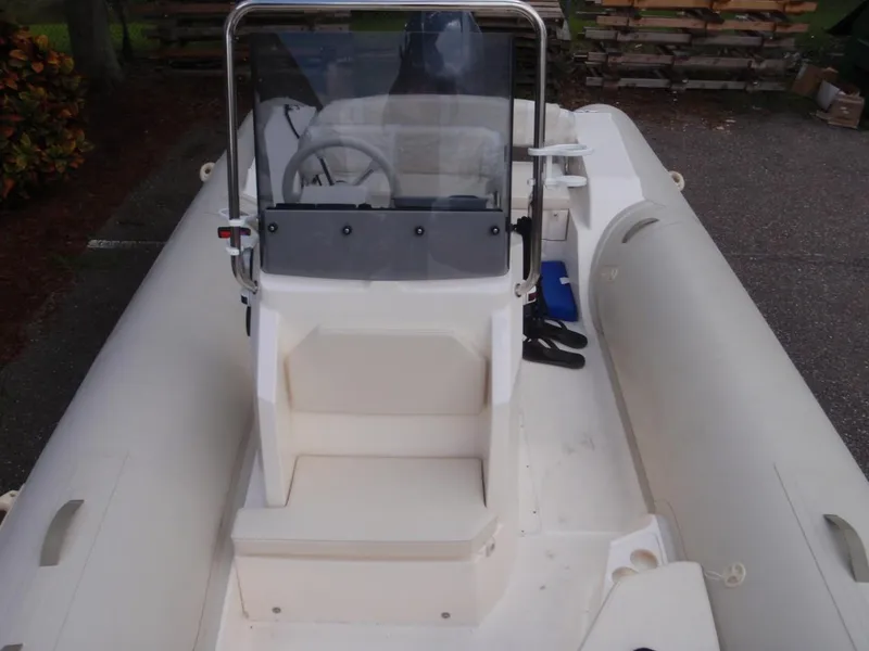 Slide: The Image of 2016 Capelli Tempest 570 inflatable boat with central console and seating. - 10