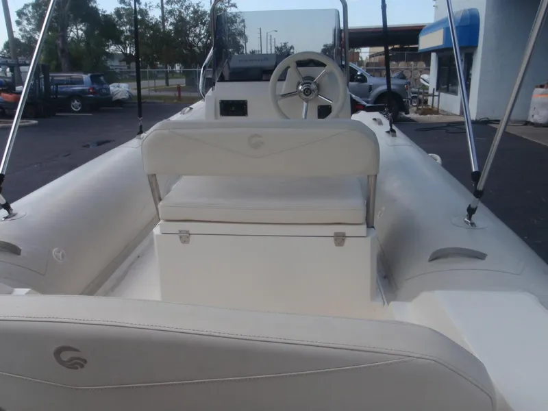 Slide: The Image of 2016 Capelli Tempest 570 boat interior with steering wheel and seating. - 12