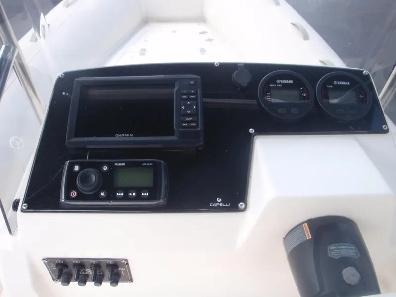 Slide: The Image of 2016 Capelli Tempest 570 dashboard with navigation and control instruments. - 16