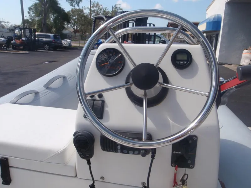 Slide: The Image of Steering console of 2017 AB Inflatables Mares 10 VSX boat, featuring gauges and controls. - 4