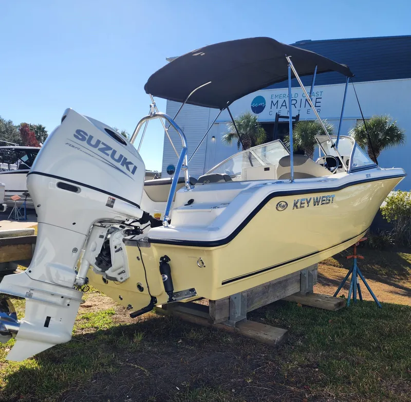 Slide: The Image of 2025 Key West 203 DFS boat with Suzuki outboard motor on display. - 1