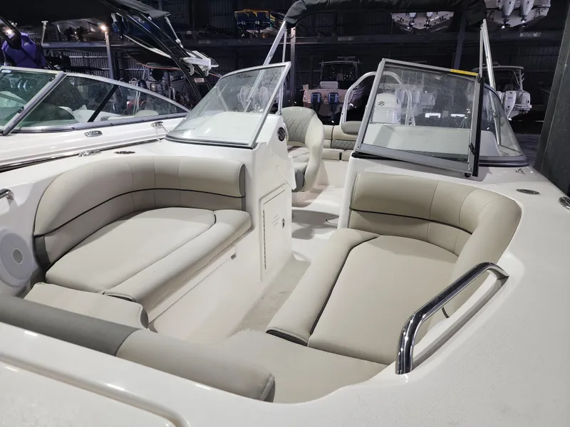 Slide: The Image of 2025 Key West 203 DFS boat interior with beige seating and windshield. - 8