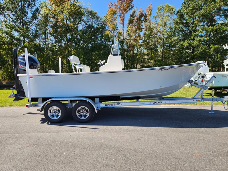 The Image of 2023 May-Craft 208 CC boat on trailer, parked outdoors. - 0