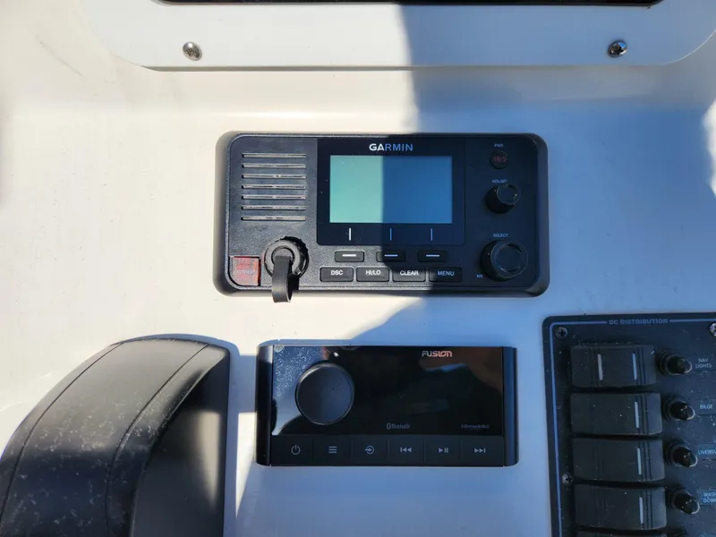 Slide: The Image of Garmin and Fusion marine electronics on 2023 May-Craft 208 CC boat dashboard. - 11