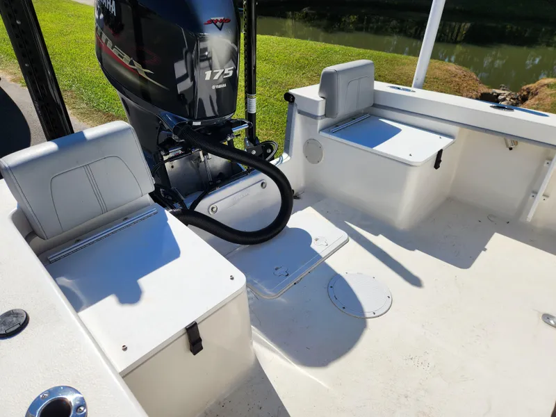 Slide: The Image of 2023 May-Craft 208 CC boat interior with Yamaha 175 engine, seating, and storage. - 18
