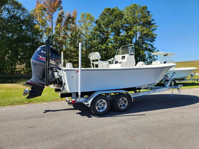 Slide: The Image of 2023 May-Craft 208 CC boat on trailer, parked outdoors. - 2