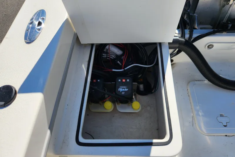 Slide: The Image of 2023 May-Craft 208 CC boat battery compartment with wiring and switches. - 20